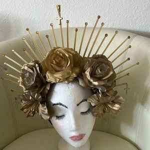 Halo headpiece on a fabric headband and fabric flowers.